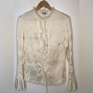 Nygard cream satiny shirt with ruffled neck and faired cuffs. Size 14